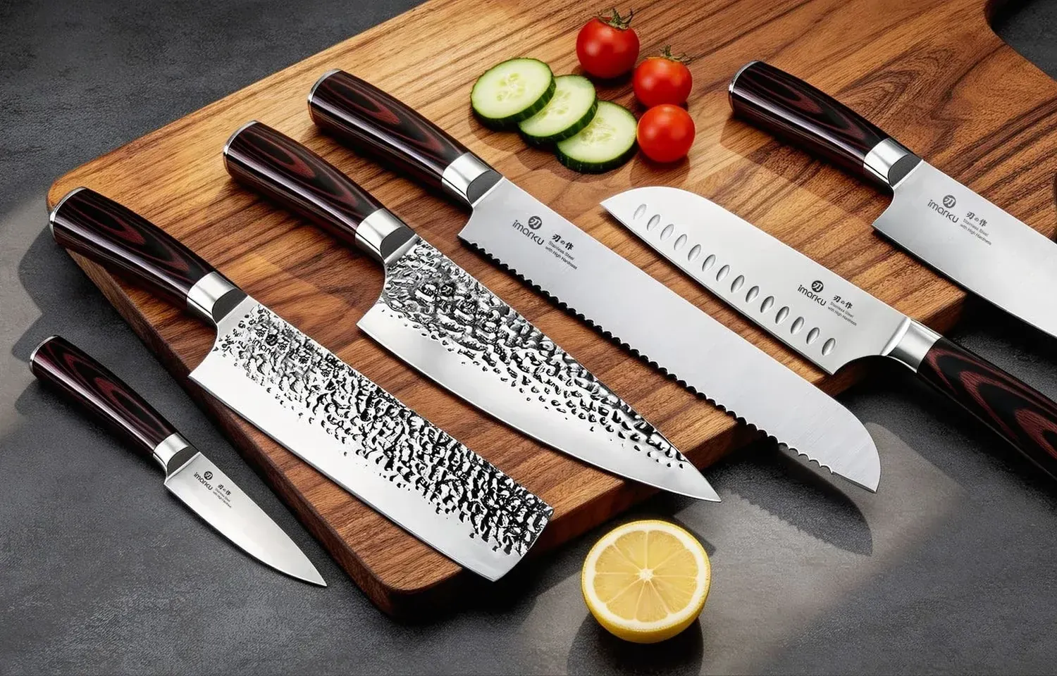 Imarku Japanese kitchen knives laid out on a dark workbench